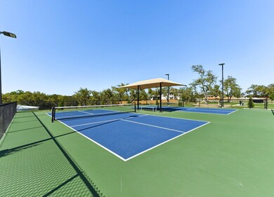View of tennis court with community basketball co
