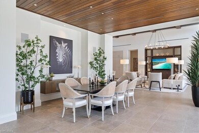 Dining room featuring wood ceiling, a chandelier, and light tile patterned floors