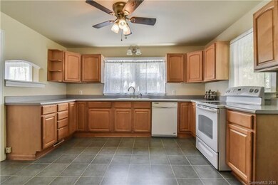 Plenty of cabinets and pass through window to dining room