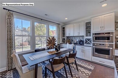 Dining room adjacent to the kitchen with beverage 