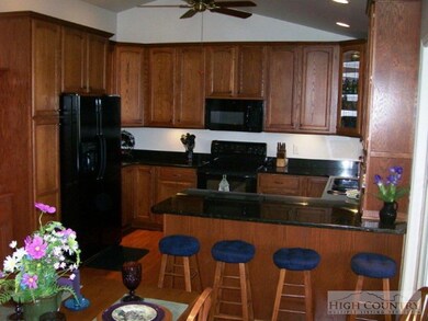 This spacious breakfast bar separates the dining r