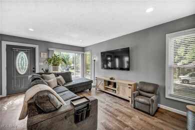 Living room with light hardwood / wood-style flooring