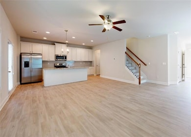 Kitchen featuring appliances with stainless steel 