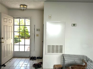 Entryway featuring light tile patterned floors and