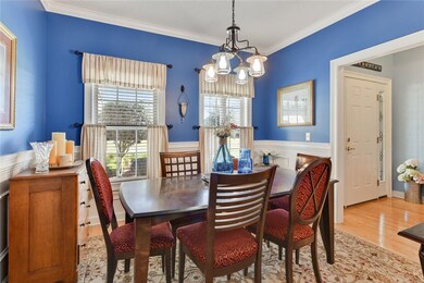 Dining Room with wainscoting and hardwood floors