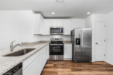 Kitchen featuring dark hardwood / wood-style floor