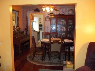 Dining room has hardwood floors.