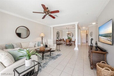 Tiled living room with ceiling fan with notable ch
