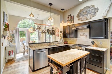 Chef's kitchen complete with SS Appliances, dual-burner Wolf oven, granite countertops, pot filler, and more