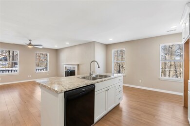The kitchen overlooks the living room.