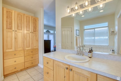 Bathroom with vanity and tile patterned floors