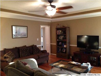 Living Room with tray ceiling, crown molding, ceil