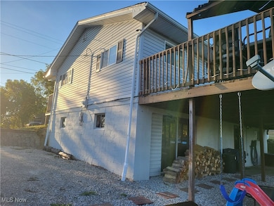 View of property exterior featuring a balcony