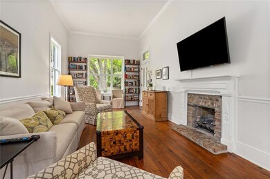 Living room with hardwood / wood-style floors, a f