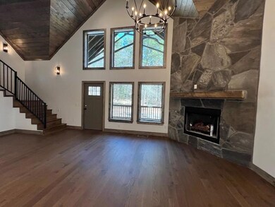 Unfurnished living room with wood finished floors,