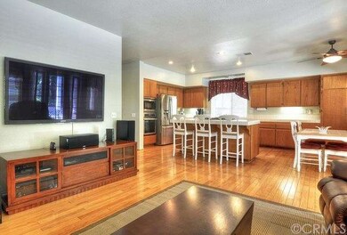 THE GREAT ROOM OF THE KITCHEN AND FAMILY ROOM IS A