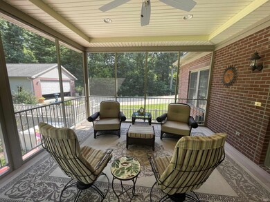 Screened porch overlooking pool