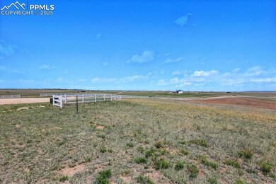 View of yard featuring a rural view and fence