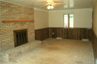 Large living room with wood burning fireplace!
