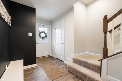 Front door brings you into large entry way with tw