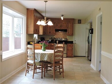 Eat-in kitchen with bay window that overlooks priv