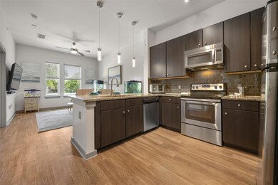 Kitchen with appliances with stainless steel fini