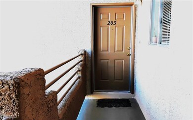 View of exterior entry with stucco siding