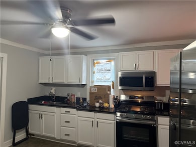 Kitchen with stainless steel appliances, a ceiling