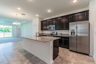 Kitchen-Photo description represents the model home of same floor plan.