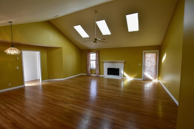 As you walk into the front door you're engulfed in this skylight lit gathering space for family and friends!