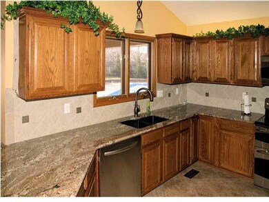 Remodeled Kitchen with Granite and New Tile Backsp