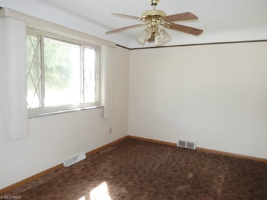 Formal Dining Room with hardwood under carpet.