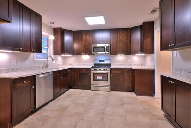 Kitchen with Stainless Steel Appliances and Granit
