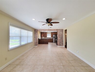 Brick Accent Wall defines the den to the kitchen a