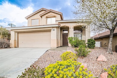 View of front of home featuring stucco siding, dri