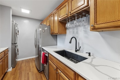 Kitchen with stacked front load washer and clothes