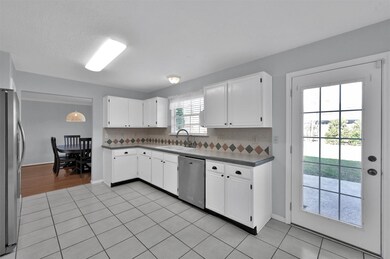 Updated kitchen overlooking backyard.