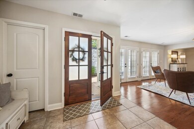 Tiled entrance foyer with a healthy amount of sunl