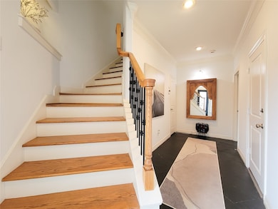 Alternate view of entryway and staircase.