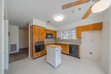 Spacious Kitchen with Garden Window above the Sink
