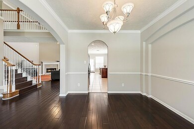 Another view of the dining area that flows seamlessly into the living room and kitchen. Hardwoods on the stairs is a new upgrade in July of 2017.