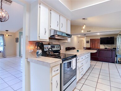 Looking from the kitchen to the front door, throug