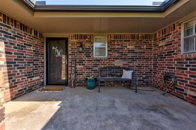 Entrance to property with brick siding