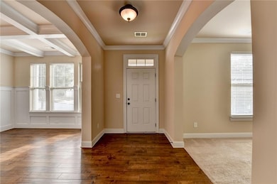 Foyer entry with views to dining room and office