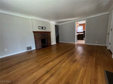Unfurnished living room with a fireplace and hardwood / wood-style flooring