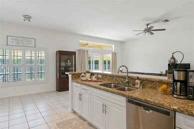 Open concept kitchen with classic white cabinets a