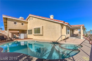 View of swimming pool featuring a patio area and a