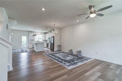 Enter into open concept family room with LVP
