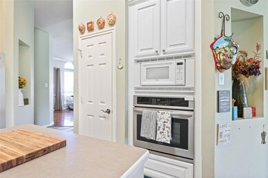 Kitchen featuring wood-type flooring, stainless st