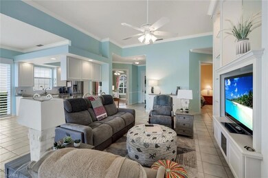 Living room with ornamental molding, ceiling fan, 